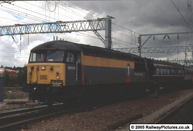 56049