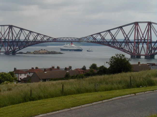 QE2 framed by the Forth Bridge